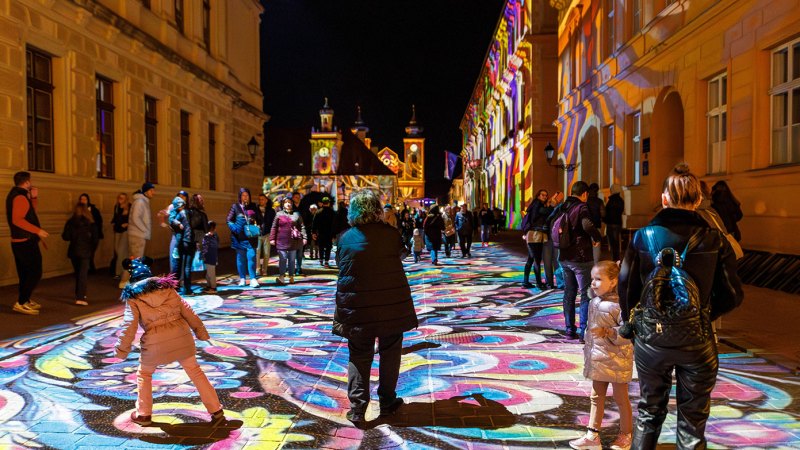 Visitors among light projections in Tvrđa, archive photograph from the HeadOnEast festival.